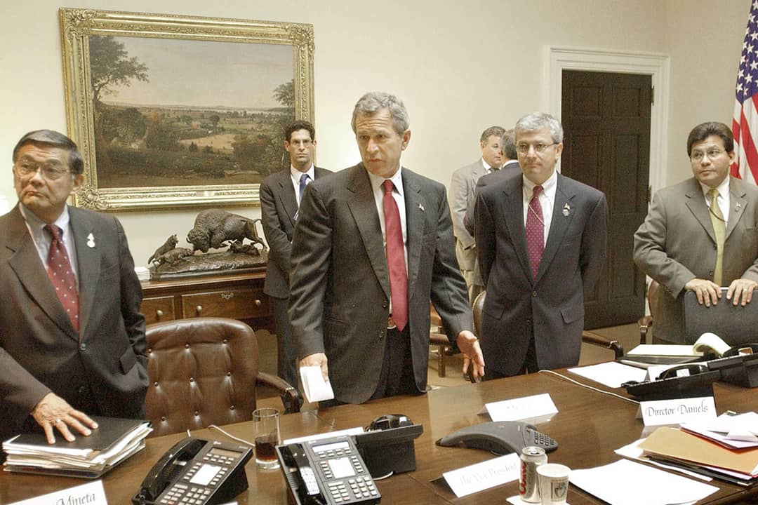 Former US President George W. Bush (2L) meeting with Transportation Secy. Norman Mineta (L), Deputy Chief of Staff Josh Bolten (2R) & WH Counsel Al Gonzalez.